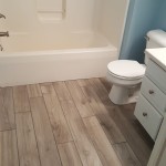 Wood look tile in a guest bath